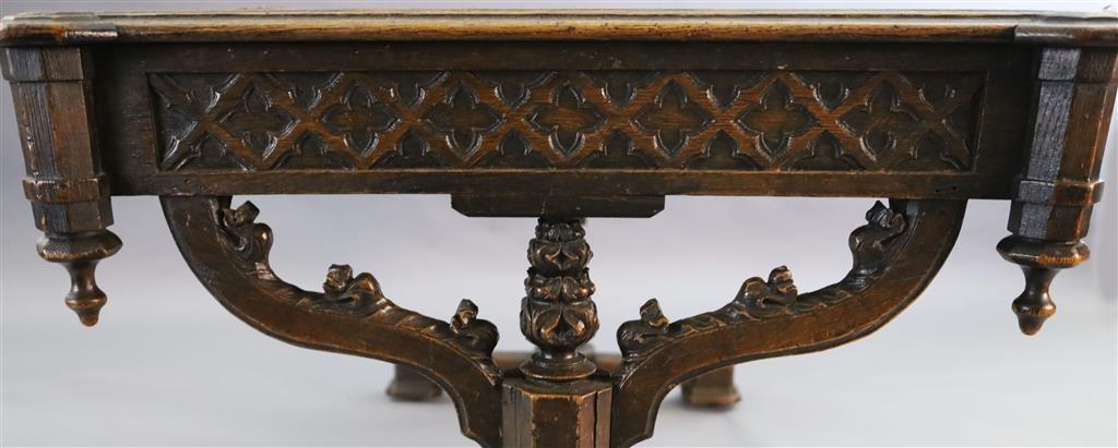 Attributed A.W.N. Pugin, A Victorian oak Gothic revival writing table, W.4ft 5.5in D.2ft 9.5in. H.2ft 6in.